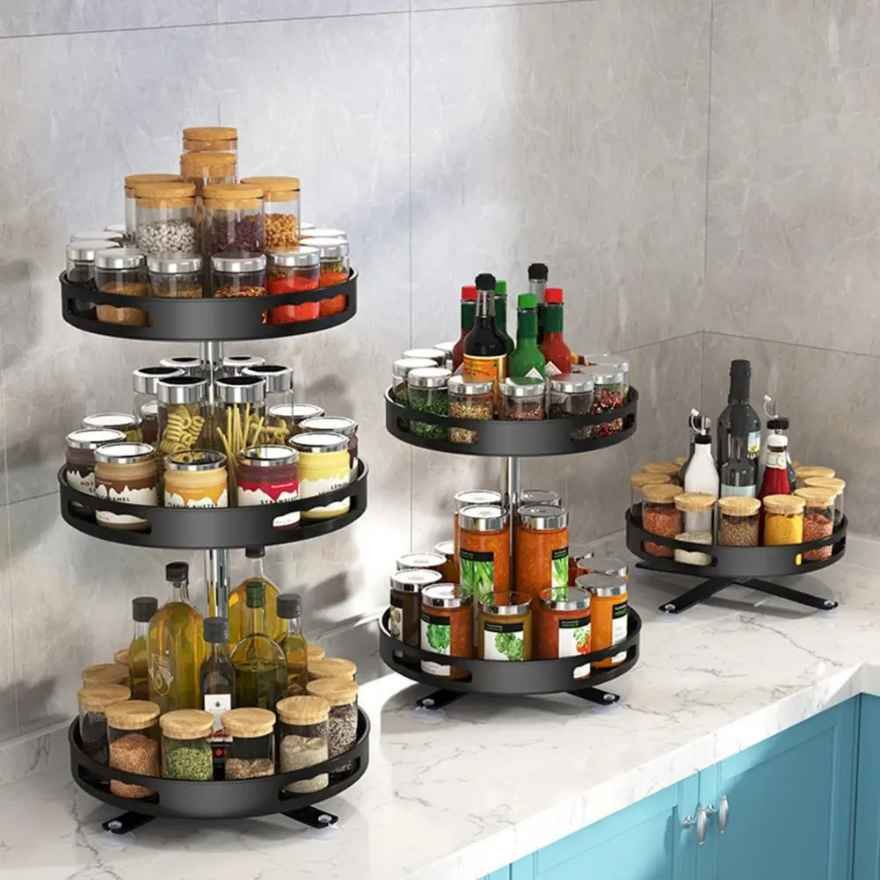 Rotating spice rack with 3 adjustable layers on kitchen counter in sleek black.