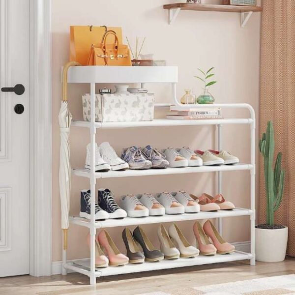 White 4-layer shoe organizer in home entryway holding shoes.