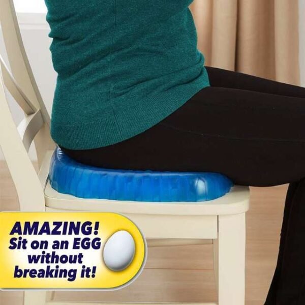 Woman comfortably seated on egg sitter seat cushion.