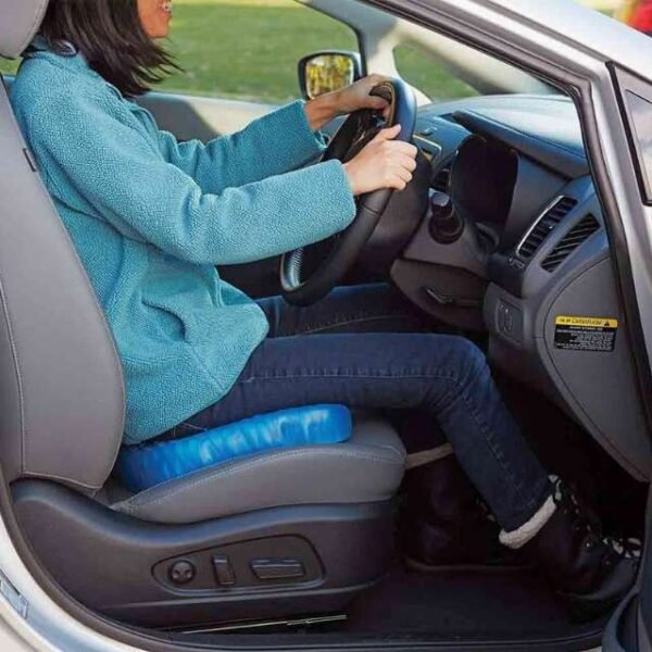 Woman driving comfortably with egg sitter seat cushion.