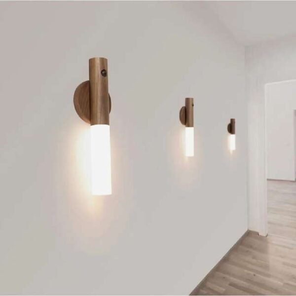 Motion sensor hallway lamps softly lighting hallway, mounted with wooden base.