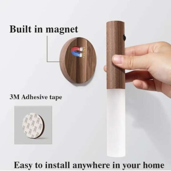 Motion sensor night light with built-in magnetic base and adhesive tape for easy installation.