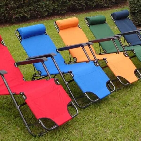 Recliner chairs in various colors set up in a garden. Available in red, blue, gray, and green.