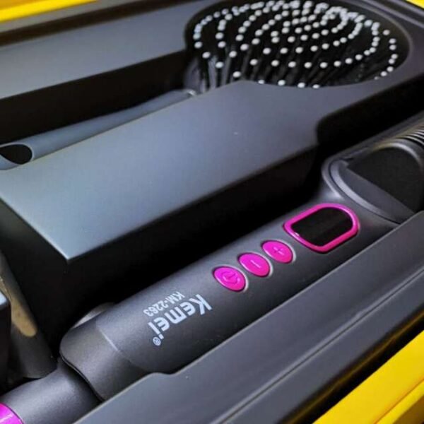 Kemei ceramic hair curler and straightener in a box with a brush comb.