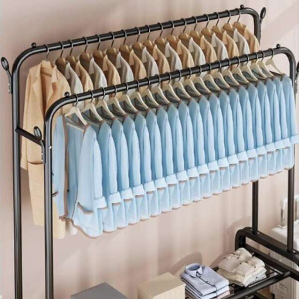 Double clothes rack with clothes lined on its hanging area, ideal for homes and boutiques.