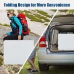 Man backpacking with lightweight folding camping table.