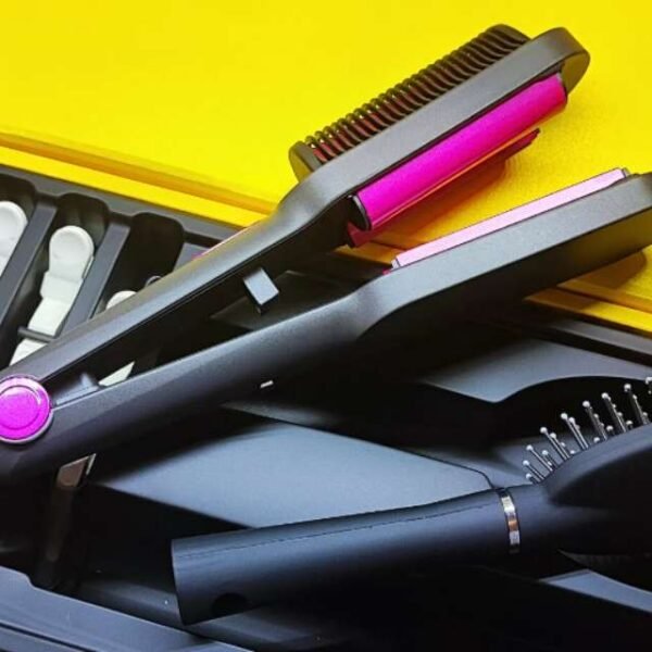 Unboxed Kemei hair curler showing black body, comb, and clips.