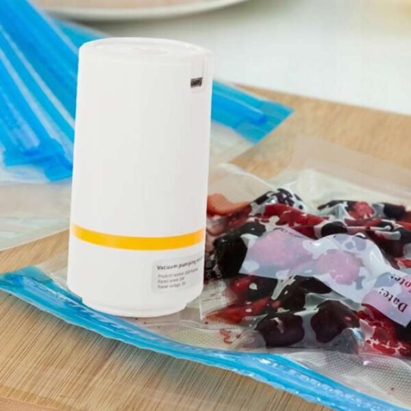 Mini vacuum sealer efficiently preserving food inside a bag with strong air pumping.