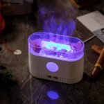 Aroma diffuser vaporizing essential oils into mist.