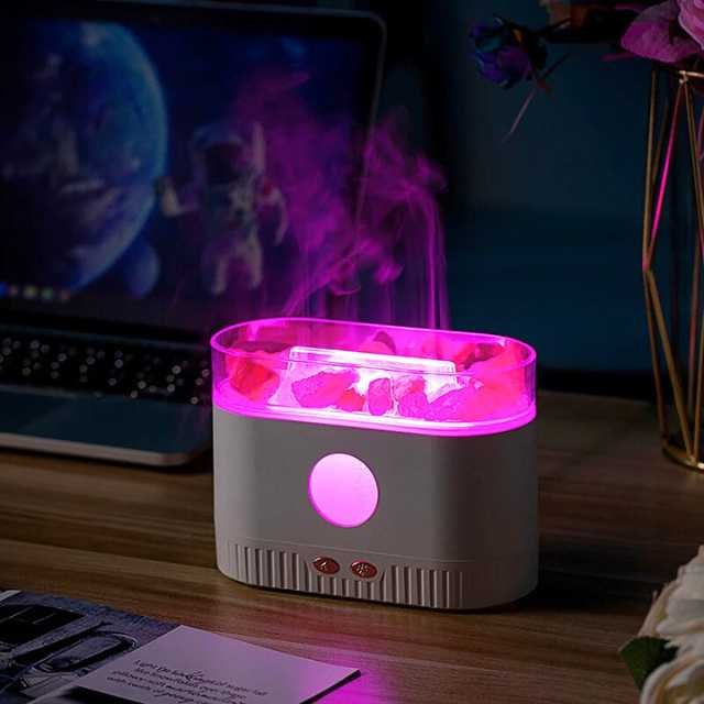 Salt lamp aroma diffuser quietly operating at night with LED lights.