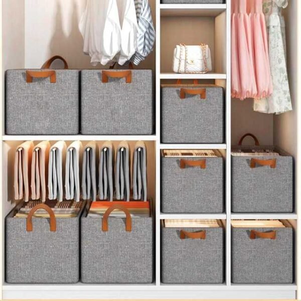 Clothes organizer boxes stacked inside a wardrobe.