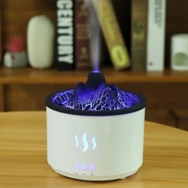 Volcano diffuser casting blue light with essential oil mist for a pleasant scent.