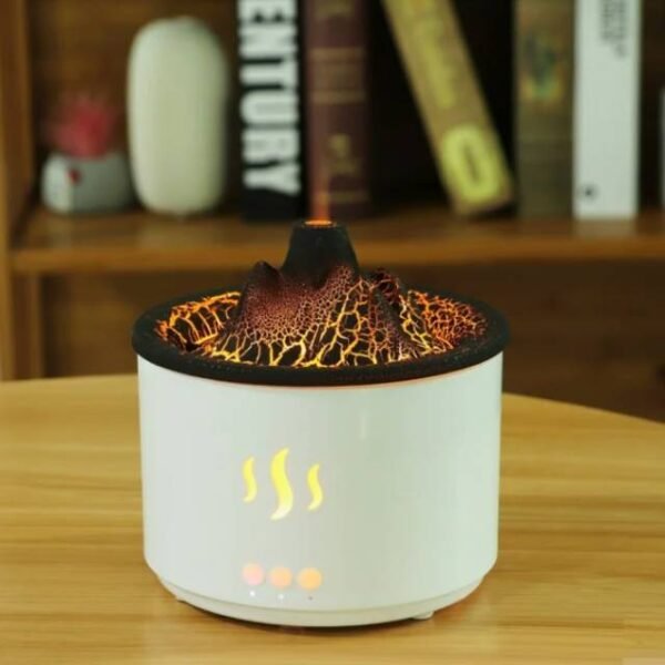 Volcano aroma diffuser casting warm light and mist in a reading room.