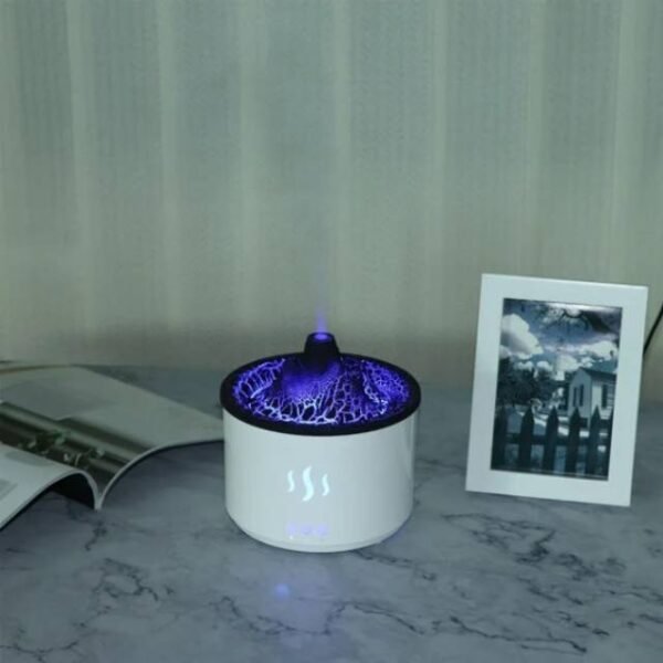 White volcano diffuser emitting scented mist to enhance living room ambiance.