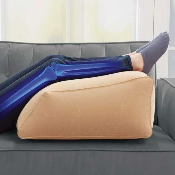 BulbHead inflatable wedge pillow easing knee pain.