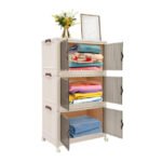 3-Tier storage cabinet open with clothes neatly stored inside.
