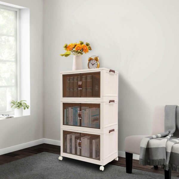 3-Tier storage cabinet in living room holding books and decor items.