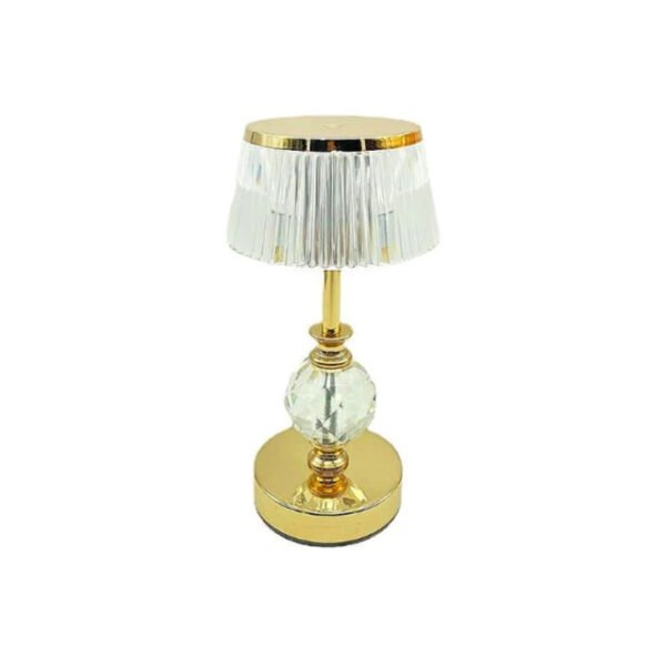 Golden crystal table lamp with gold accents for modern settings.