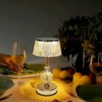 Golden crystal table lamp on a counter with rechargeable and cordless design