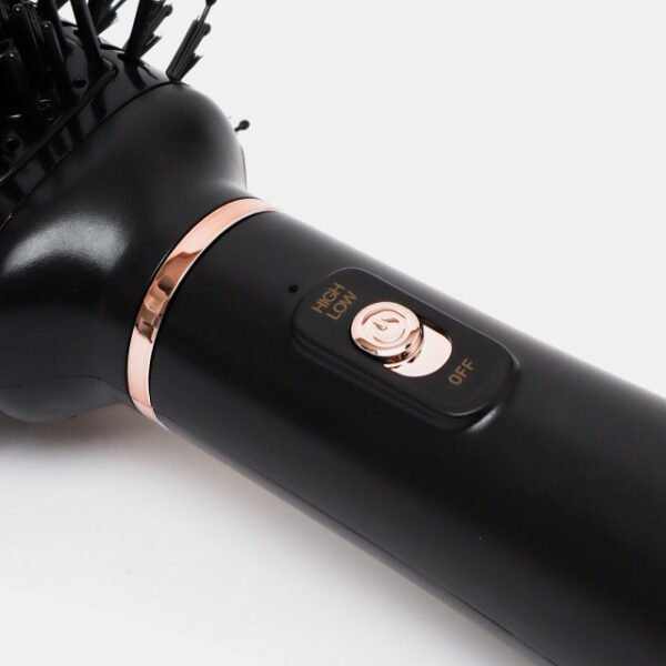 Close-up of the high and low heat settings on the MAC hot air brush for easy control.