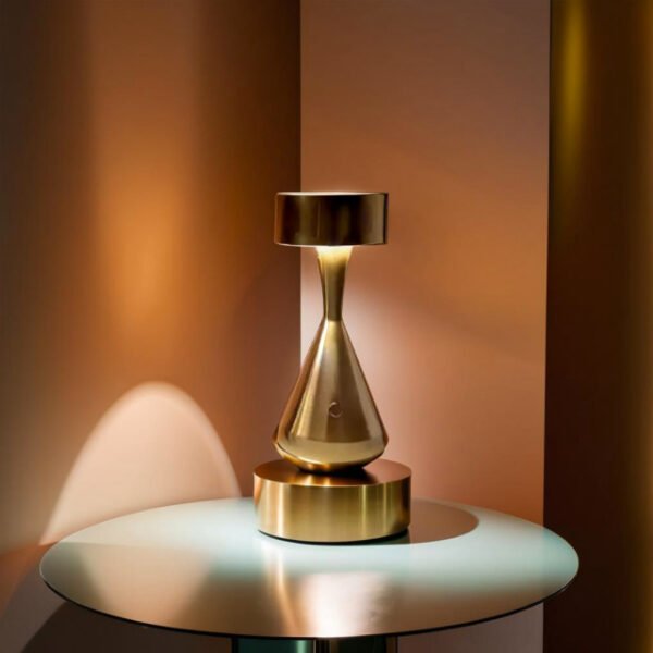 Minimalist bronze table lamp in living room corner with conical design and warm light.