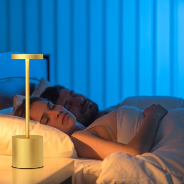 Couples sleeping next to a bedside table lamp while it creates a romantic ambiance.