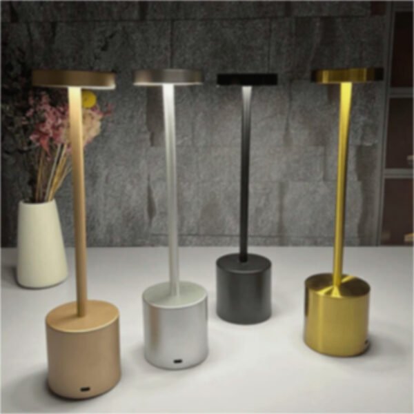 Modern table lamps in black, gold, rose gold, and frosted gold displayed together.