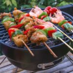 Portable outdoor grill in action, cooking food efficiently.