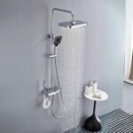 Thermostatic shower mixer in chrome displaying powerful water flow.