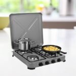 4-burner gas stove placed on kitchen counter in stylish grey.
