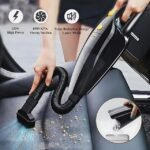 Woman attaching brush to portable vacuum cleaner for effective cleaning.