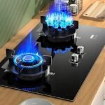 Digital gas stove with brightly lit burners for efficient heat control.