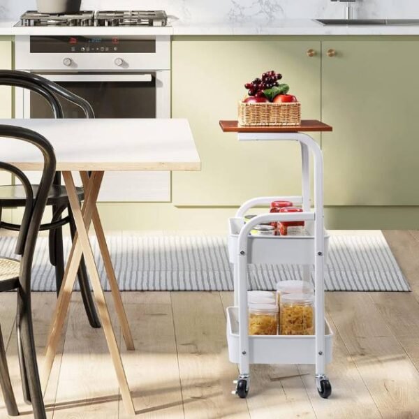 Kitchen storage trolley with wooden top and two lower baskets for easy organization.