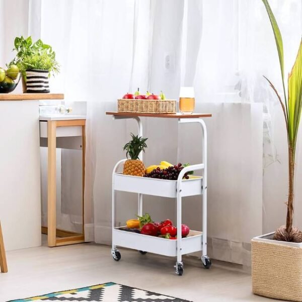 White kitchen storage trolley holding fruit and vegetables for easy organization.