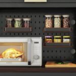 DIY pegboard in modern kitchen cabinet for organizing spice jars.