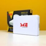 SKE UPS router with package in background for smart power supply.