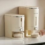 Woman using UFORU rice dispenser on countertop for easy rice serving.
