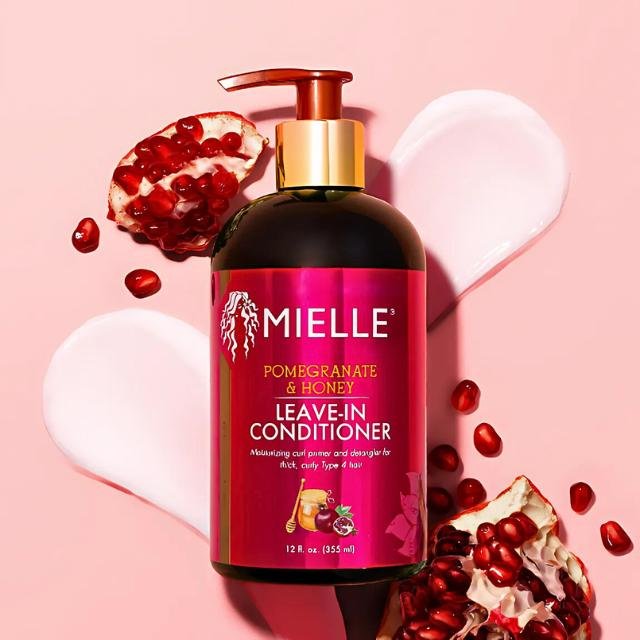 Mielle leave-in conditioner with pomegranate and honey for repairing frizzy, damaged hair.