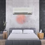 Renova wall-mounted heater warming up a cozy bedroom with hot air.