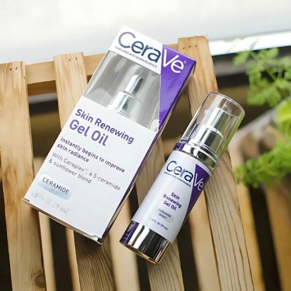 CeraVe skin renewing gel oil and box displayed on a wooden table.