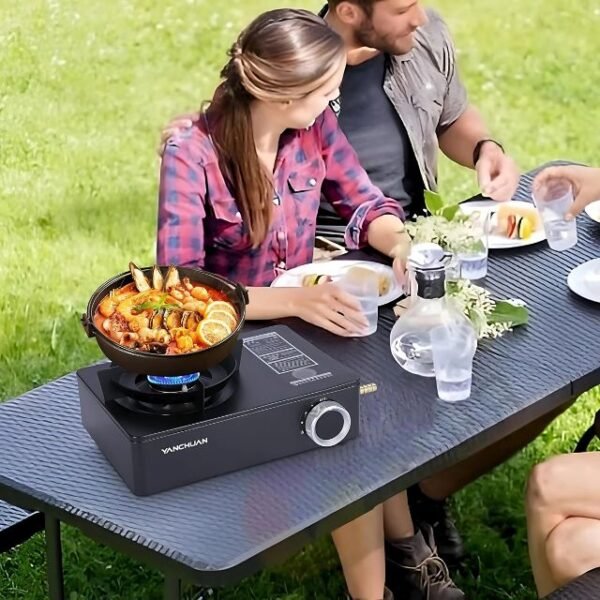 Family dining on food made with a modern camping stove in an outdoor setting