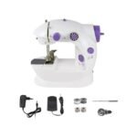 Portable sewing machine with accessories including bobbins and foot pedal.