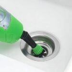 X5 steam cleaner cleaning narrow sink areas in a bathroom.