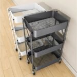 Two rolling carts with three mesh tiers each, in black and white, ideal for practical storage at home or the office.