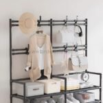 Black 7-tier storage rack with hooks and shelves for shoes, clothes, bags, and accessories. Great for organizing entryways or bedrooms.