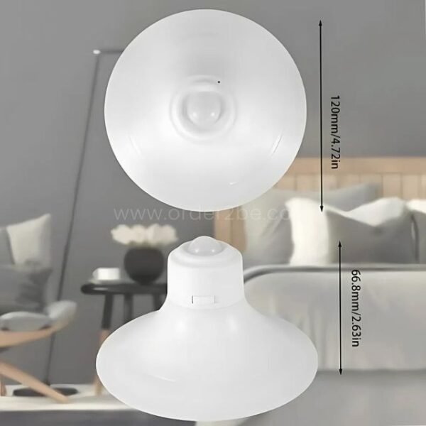 Dome-shaped motion sensor wall lamp in a modern bedroom.