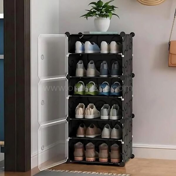 Black 6-tier shoe cabinet with translucent doors, placed by a doorway with a potted plant.