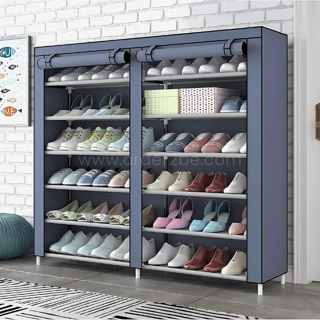 Grey double shoe rack with multiple tiers, showcasing shoes neatly arranged against a white brick wall. The dustproof fabric cover rolls up for easy access.