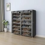 Grey double shoe rack with multiple shelves, neatly organizing various shoes against a light blue wall with decor accents.