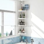 Adjustable shower corner rack with four tiers holding toiletries, loofah, and towel in a bathroom corner.